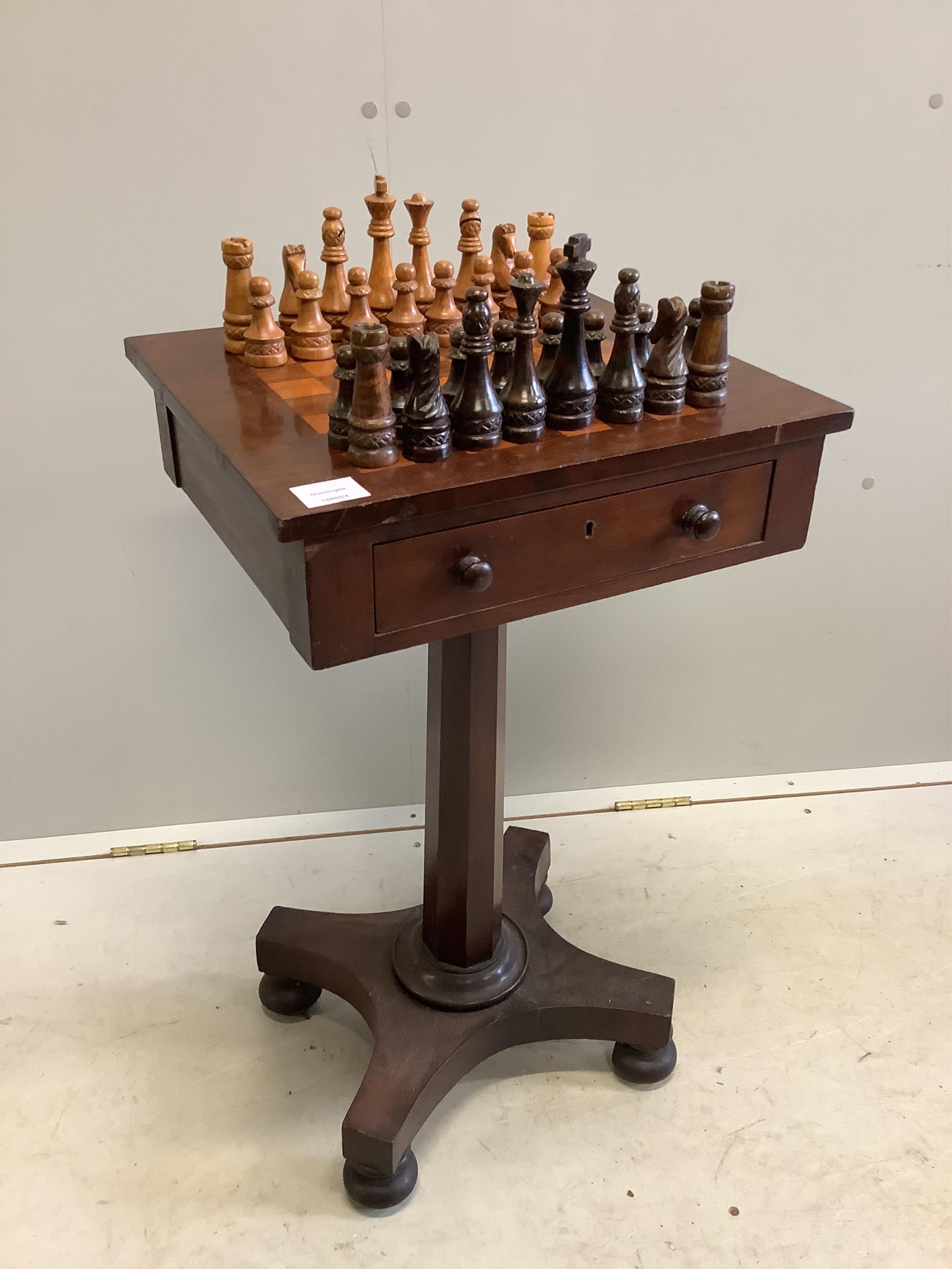 A Victorian mahogany games table, width 44cm, depth 38cm, height 74cm, together with a later turned wood chess set. Condition - fair to good